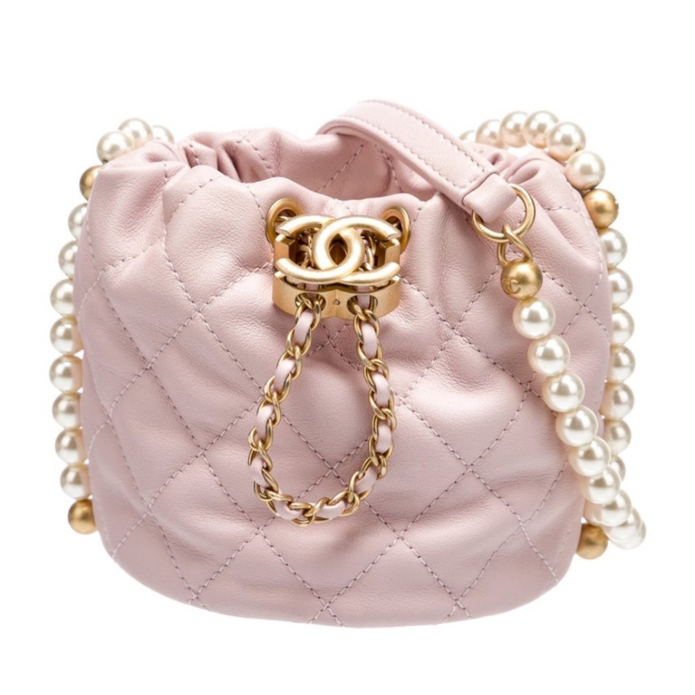 CHANEL Light Pink Quilted Mini Drawstring Bag with Pearl Chain.  Never Used.